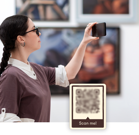 Visitor scanning artwork label with a smartphone